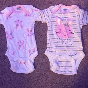 2 matching bunny onesies for newborn infants
